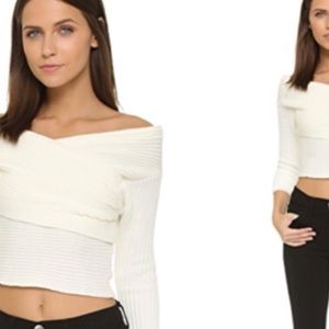 Line and dot cropped off the shoulder sweater.